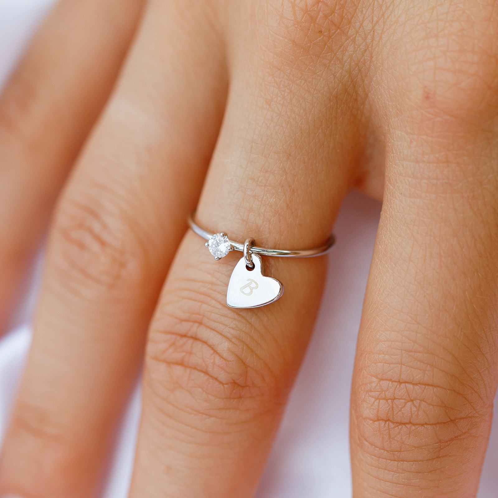 Silver ring deals with heart charm