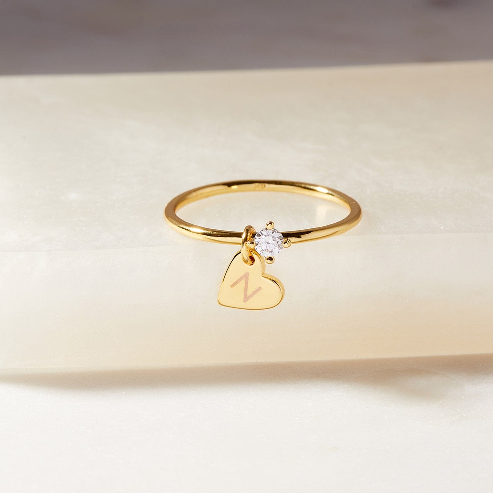 Gold heart ring with on sale letter